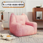 A sofa and a bear-shaped sofa.