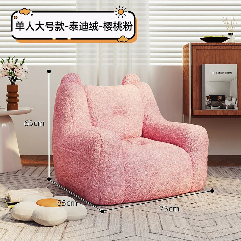 A sofa and a bear-shaped sofa.