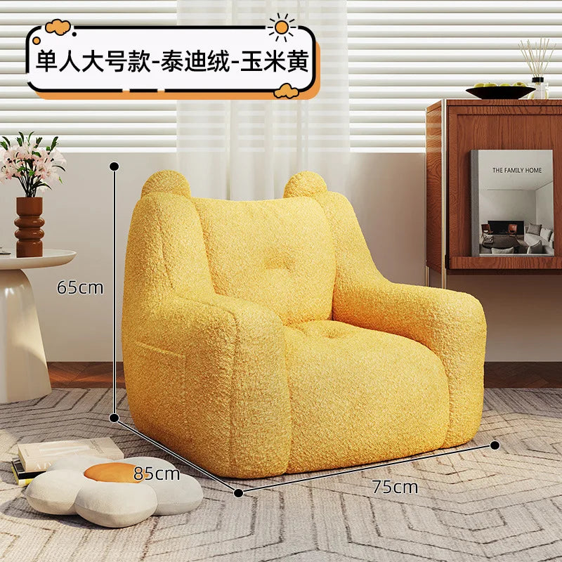 A sofa and a bear-shaped sofa.