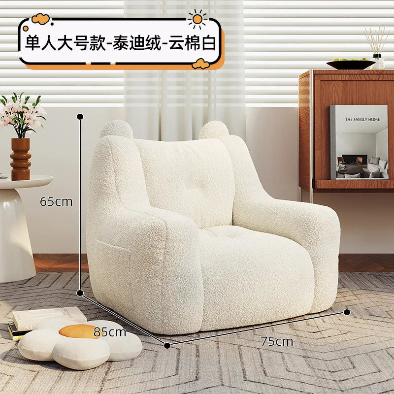 A sofa and a bear-shaped sofa.