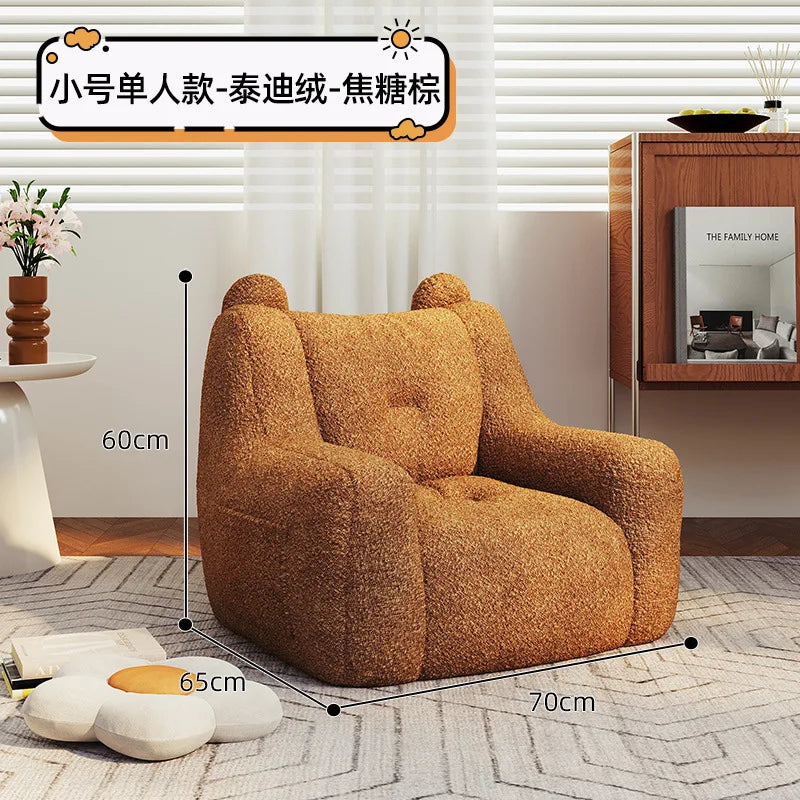 A sofa and a bear-shaped sofa.